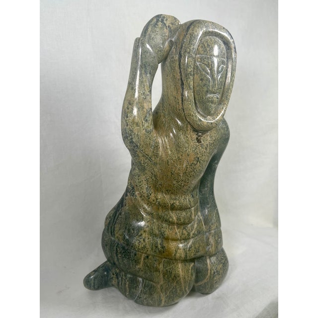 This beautiful piece is hand-carved out of solid serpentine/steatite stone with natural green veining . The artist took...