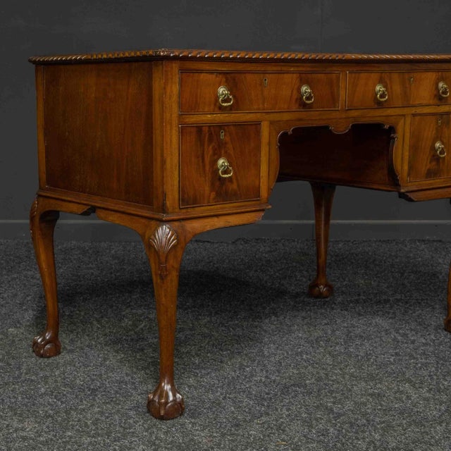 A small ladies Chippendale style mahogany desk from the Edwardian period. Raised on typical cabriole legs with ball and...
