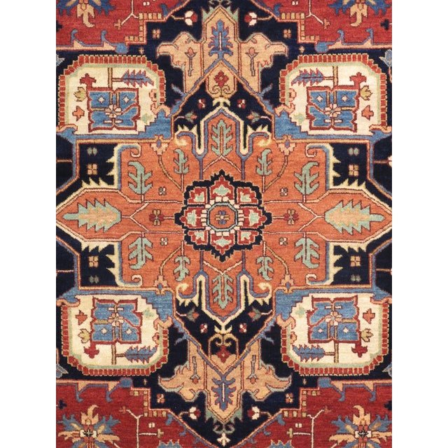 The Serapi Collection reinterprets traditional tribal geometric design through a refined palette. Each rug is hand-knotted...