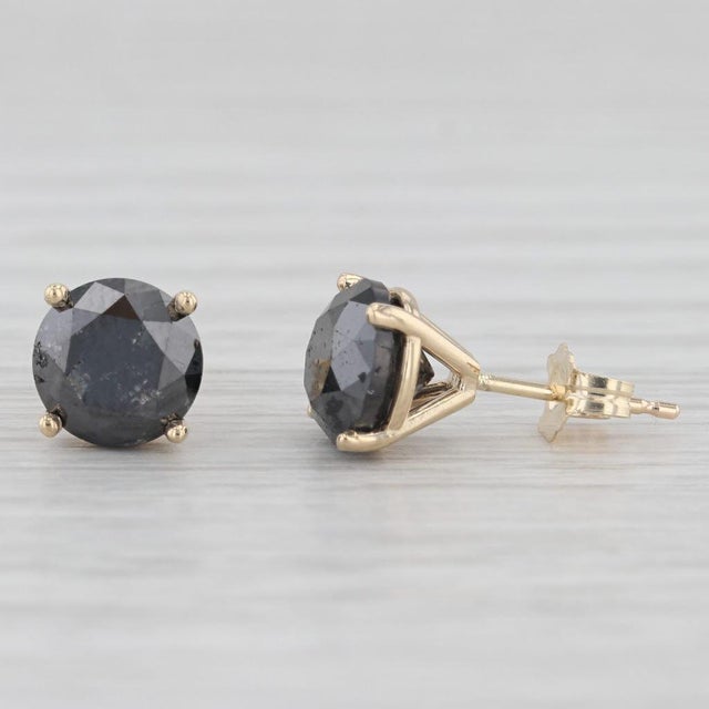 Gemstone Information: - Natural Diamonds - Total Carats - 3.70ctw Cut - Round Brilliant Color - Black Metal: 14k Yellow...