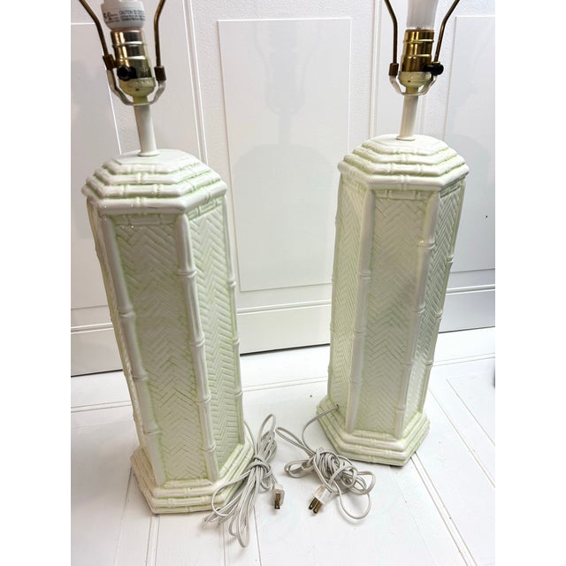This is a 1960 vintage Palm Beach Regency faux bamboo pagoda table lamp. Shape: Tall, octagonal column structure with a...