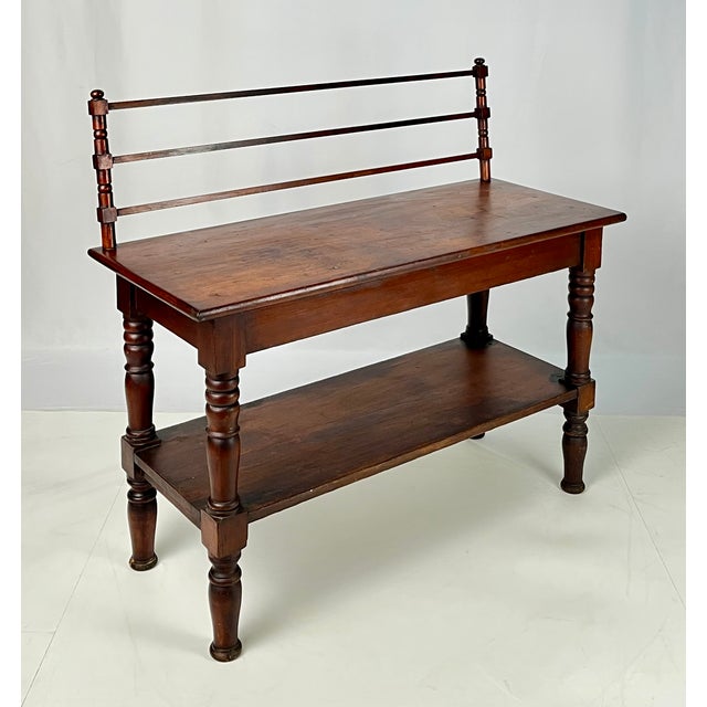 Bring authentic rustic warmth and character to your space with this unusual antique baker's rack/washstand console table....