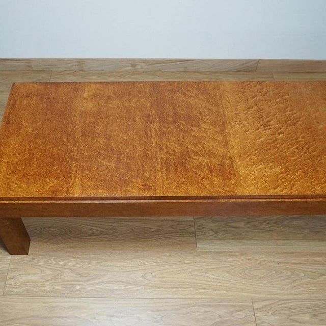 An Art Deco maple and lacewood coffee table. Dimensions: H 42cm W 150cm D 57.5cm Origin: English Date: Circa 1935