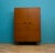 A mid-century Stonehill teak double wardrobe raised on tapering legs, featuring original ebonised recessed circular...