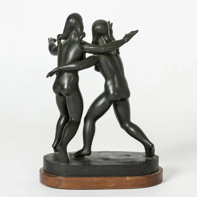 Beautiful bronze figurine by Nils Fougstedt, in the form of two young women. The women are reaching out their arms and...
