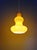 Vintage pendant light with an organic shape, made of yellow opaline glass, produced in Italy in the 1960s-70s. The pendant...