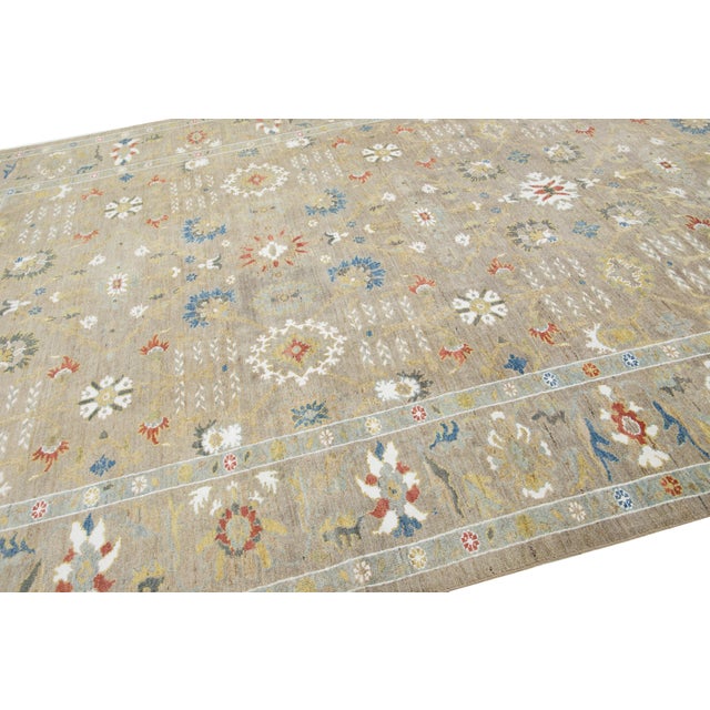 This 1980's vintage Sultanabad rug embodies the timeless elegance of Persian weaving traditions with a light and...