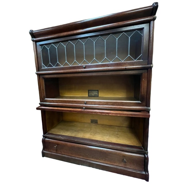 Antique barrister 3 stacker bookcase by The Globe Wernicke Co. Cincinnati. Features include: - Leaded glass on top shelf -...