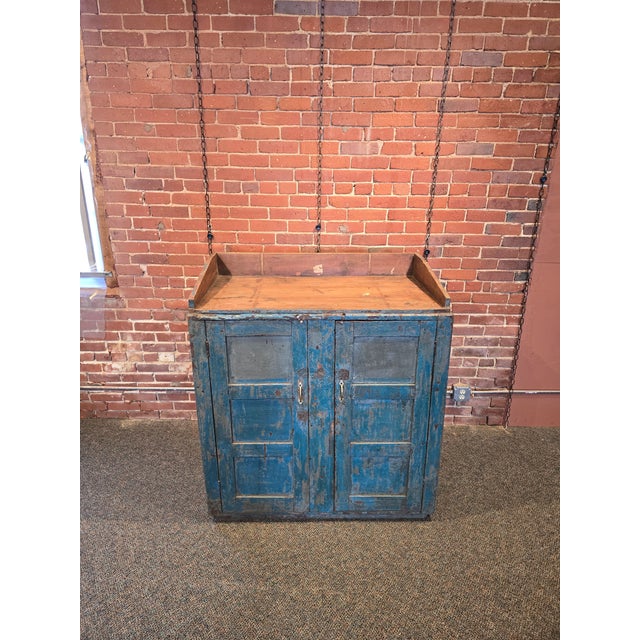 Originally designed as a standing shop foreman’s desk or a general store workstation, this piece features a slanted top...