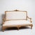 Elegant French Louis XVI giltwood settee with new linen upholstery, ribbon gimp, and nailhead trim. The body of the settee...
