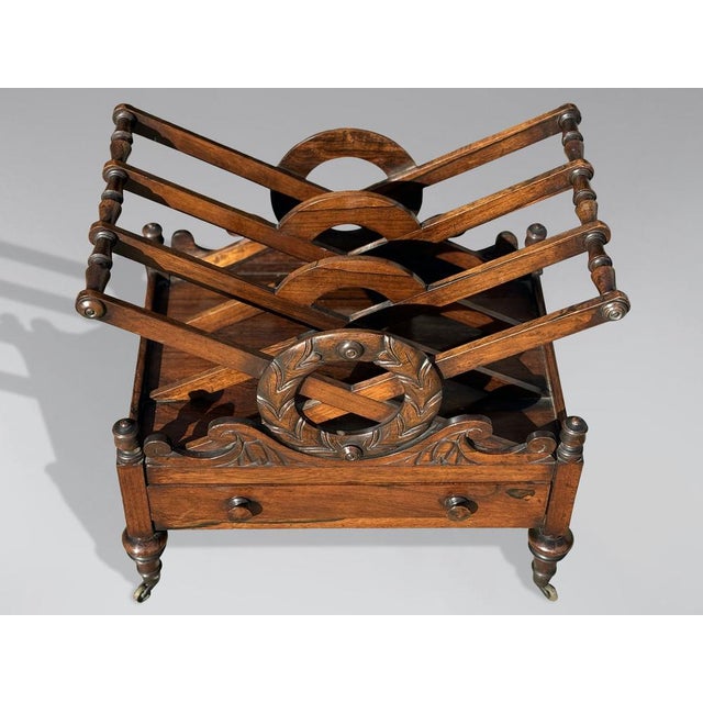 An early 19th-century Regency period rosewood Canterbury, used as a magazine or newspaper stand. It features a striking...