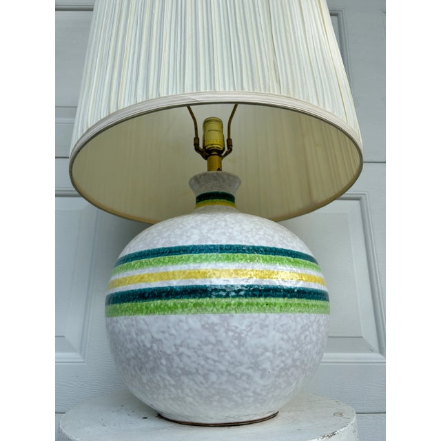 A fantastic mid century modern glazed terracotta lamp. Round form with a heavy Italian influence. Semi-gloss textured...