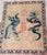 An impressive antique Chinese wedding carpet featuring a dramatic dragon and phoenix composition surrounding the prominent...