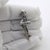 Full of human warmth and nostalgic narrative charm, this vintage silver figurine depicts an elderly man engaged in a game...