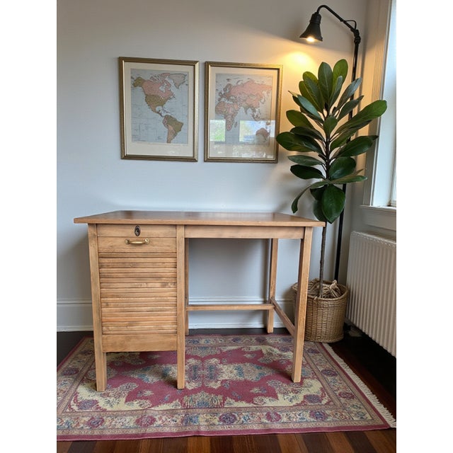 This charming vintage writing desk captures the understated elegance of mid-century European design. Crafted from solid...