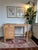 This charming vintage writing desk captures the understated elegance of mid-century European design. Crafted from solid...