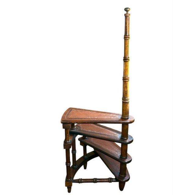 Victorian library ladder, circa 1900, of English origin and made of oak. It features spirally twisted triangular steps, a...