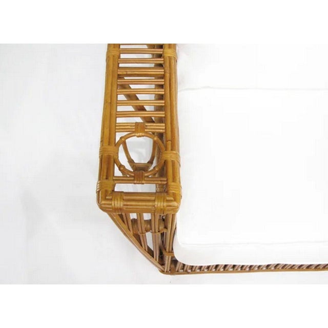 \This striking Nantucket 3-seater sofa features classic stick rattan framing with tightly woven wicker wrappings, offering...