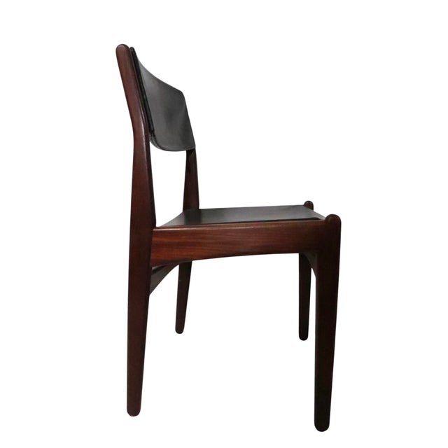 Set of six Mid Century Danish Modern dining chairs by Frem Rojle. The set consists of two arm, and four side chairs,...