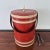 Vintage red faux leather tall ice bucket signed Georges Briard. The ice bucket is insulated inside and has a lid and a...
