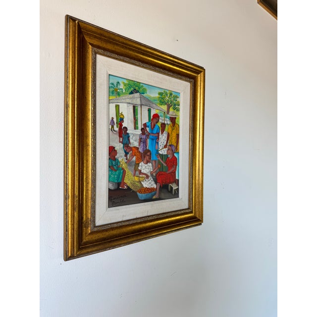 This captivating vintage oil painting by Haitian artist Louines Mentor, created in the 1980s, beautifully captures the...