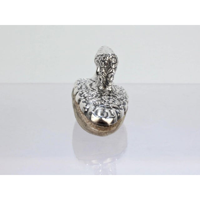 An antique Tiffany & Co Sterling Floral Repousse Nail Buffer. Decorated throughout with beautifully intricate floral...