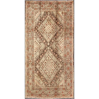 Early 20th Century Antique Khotan Rug With Paired Diamond Medallions in Brown and Earth Tones For Sale