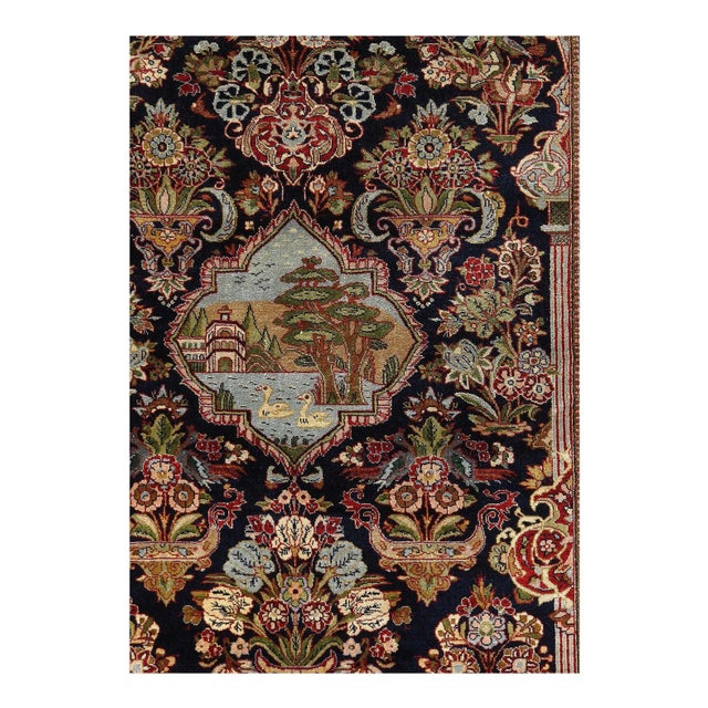 This regal Persian Kashan has an elegant floral pattern of blues and creams woven into a pomegranate Navy background. This...