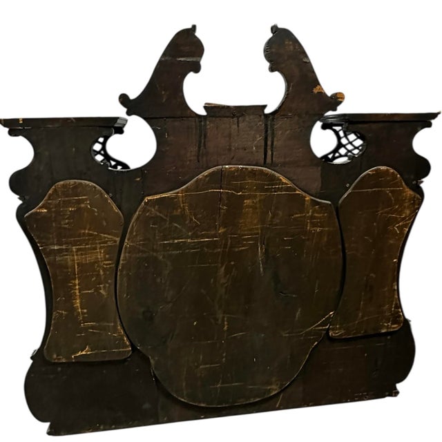 Late Victorian Chippendale Revival architectural mirror, circa 1870–1895, featuring a deep ebonized-style wood finish,...