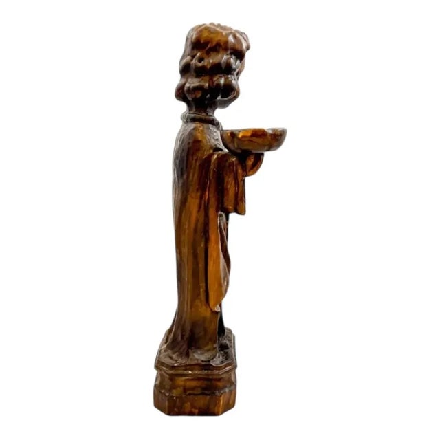 This is a beautifully executed and highly elegant candlestick figure, dating from the mid-18th century. The sculpture...