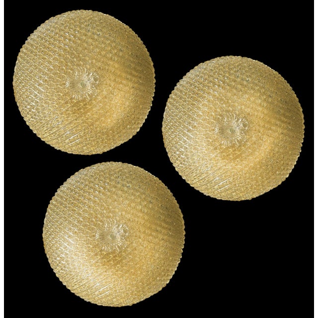 Gorgeous set of three ceiling lights made of high quality Murano Glass with gold inclusions. Perfectly preserved and in...