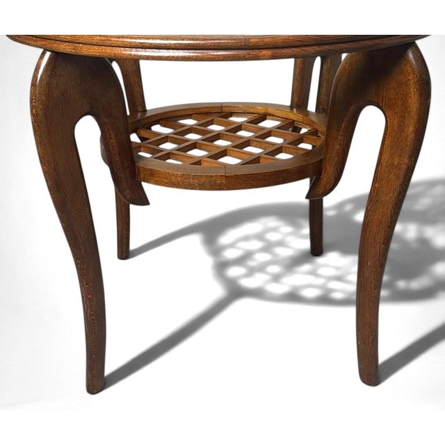 Elegant and refined Italian Art Deco side table crafted from light walnut wood. The upper top, distinguished by its clean...