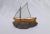 Glass and Rock. A colorful stained-glass sailboat set into a natural rock. The sailboat measures 7 x 5 5/8 inches. On...