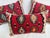 A set of three pillows upholstered in richly textured kilim weave, featuring warm red tones and distinctive hexagonal...