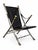 Striking neoclassical campaign-style folding chairs crafted in a refined combination of steel and solid brass with black...