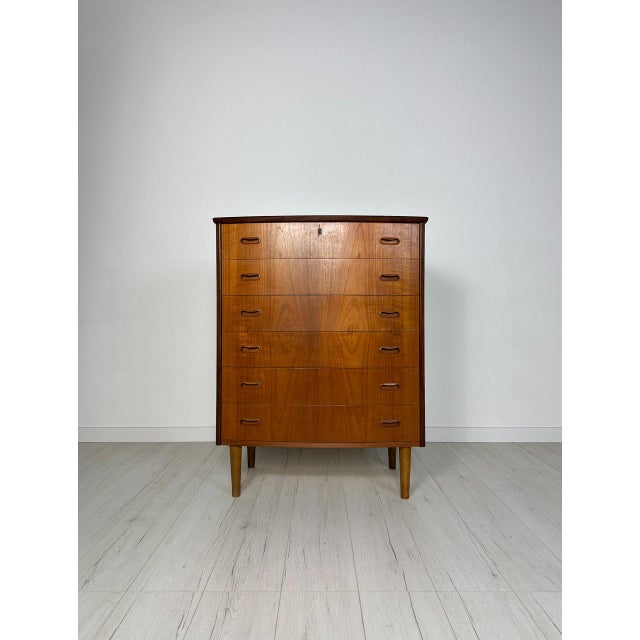 Stunning Danish Mid-Century dresser from the 1960s. Beautifully crafted in teak, this piece showcases the refined...