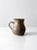 Vintage hand-crafted studio pottery pitcher featuring a refined taupe and blue glaze. The softly blended tones create a...
