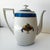 Elegant French Art Deco TLB Limoges porcelain teapot featuring a distinctive ribbed body, wide cobalt blue band, and...