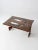 A vintage coffee table from 1988 with a playful ocean-inspired design. Artist-signed, the carved wood table features...
