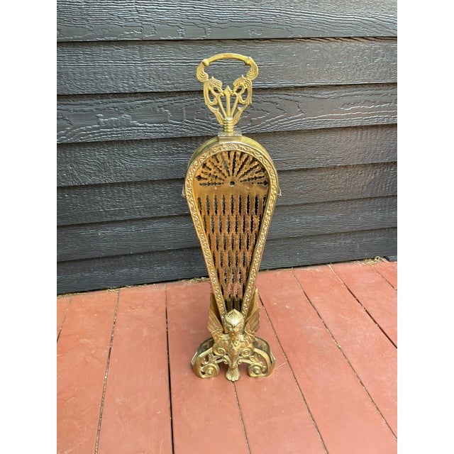 Solid brass peacock-style expandable fireplace screen. Early 1900s vintage in good condition. Clasps on each side to hold...