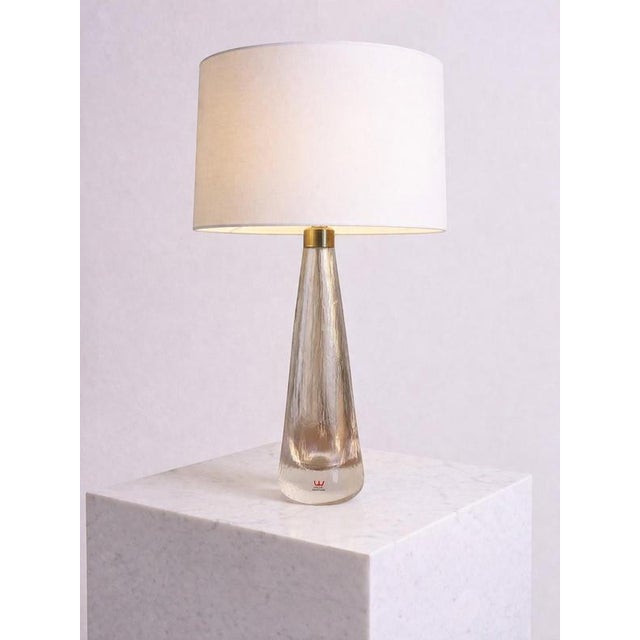 Elegant scandinavian modern table lamp designed by vicke lindstrand for kosta glasbruk, sweden, circa 1950s. The lamp...