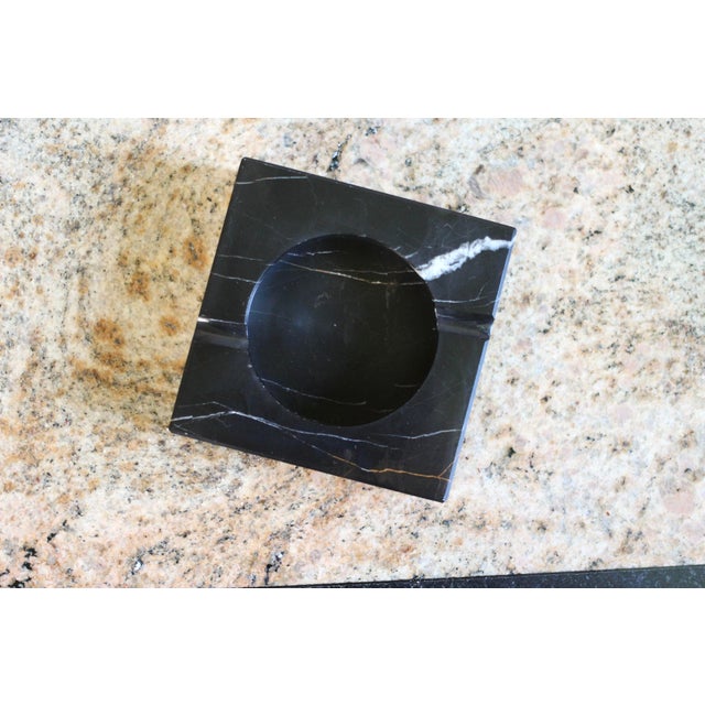 A black with white lines 1970s Italian modernist stone ashtray that can be used as an incense burner, jewelry dish or...