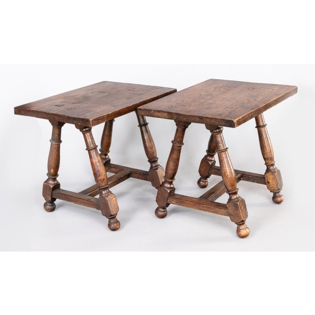 A superb pair of antique 19th Century English oak pegged joint stools or side tables with hand turned splayed legs. These...