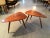 A near pair of sculpted tripod triangular tables in American Walnut studio crafted by Phil Powell in his New Hope Studio....
