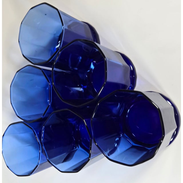 Darkest ocean cobalt was all the rage in the 90s- from TV sets to home, and these glasses are still all that and a bag of...