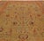 This circa-1920 antique Persian Sultanabad area rug features an all-over design of floral motifs and abstractions in...