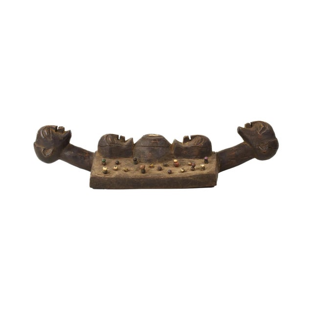 Hand-carved Luba Divination Plank from the Democratic Republic of the Congo. These pieces usually are decorated with beads...
