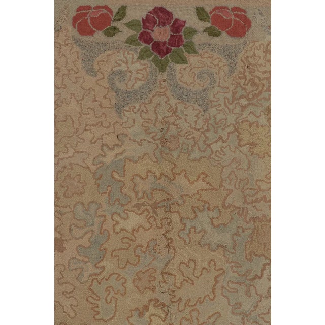 Handmade in wool, this 7x8 antique hooked rug, circa 1920–1930. The design features a whimsical all-over vinework field...