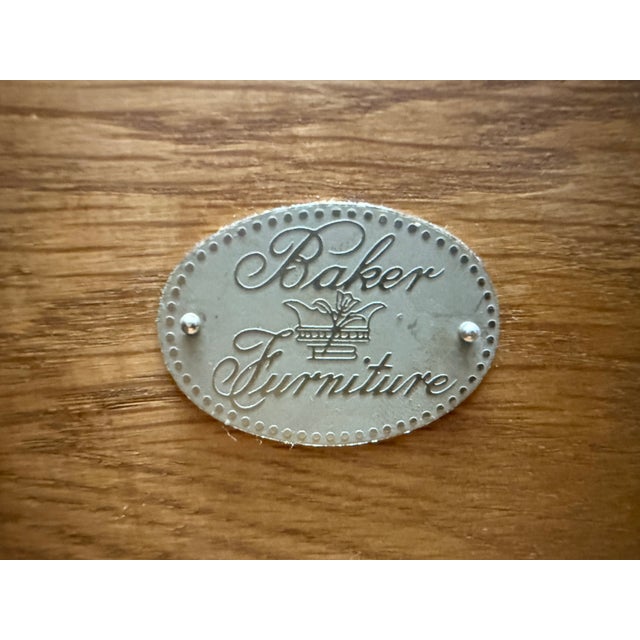 Elegant Baker Furniture executive desk featuring a richly finished wood case, genuine leather writing surface with...
