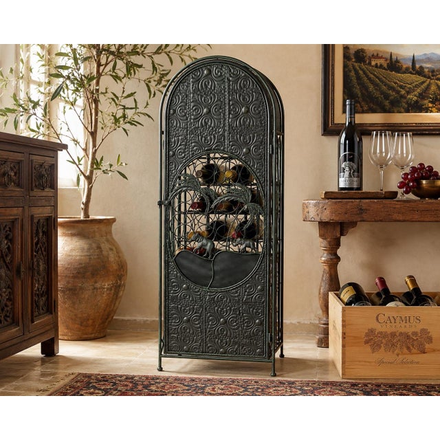 Bring dramatic global style to your home or wine cellar with this exceptional floor-standing wrought iron wine rack....